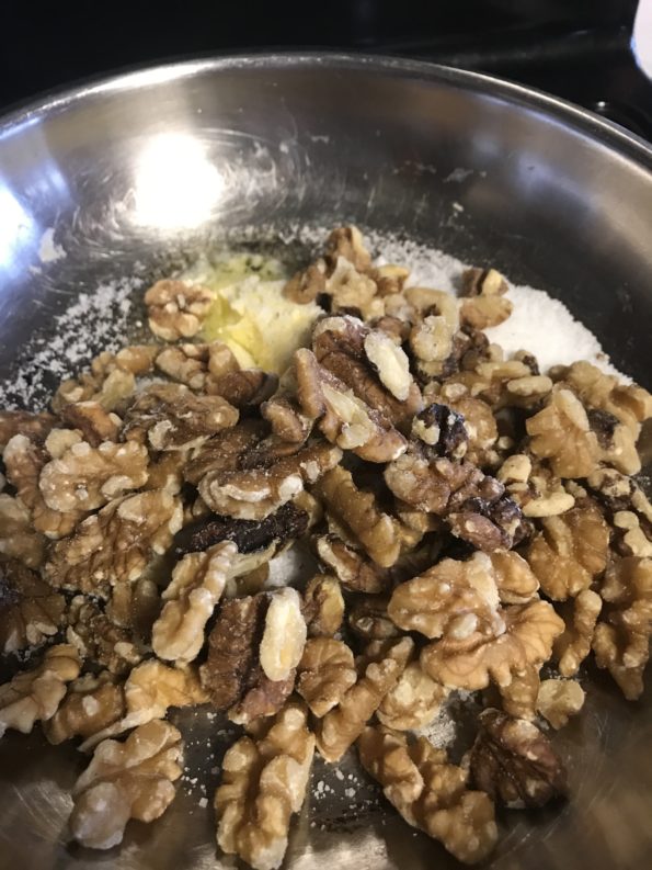 Walnuts, sugar and butter in a pan