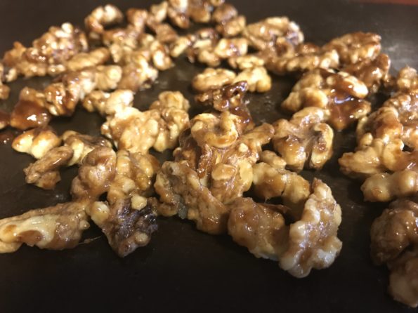 caramel candied walnuts on silicone baking sheet